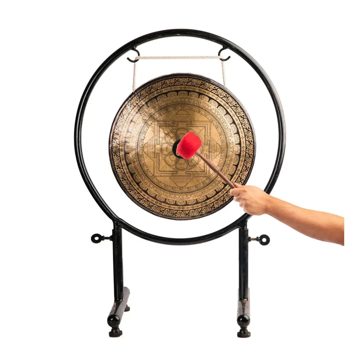Hand striking the Spiritual Om Mandala Gong with the included mallet